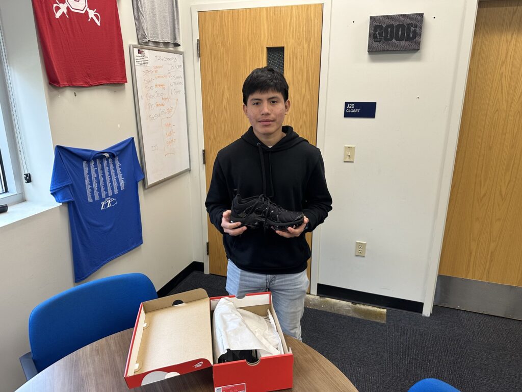 Students who won the Perfect Attendance Customized Shoe raffle receive their prizes!